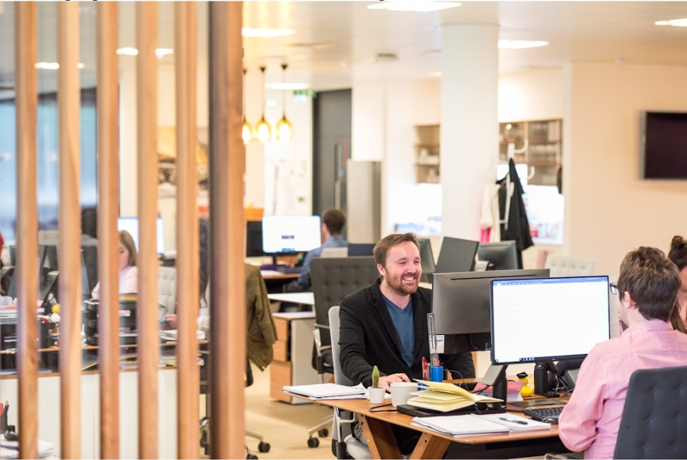 Team members in an office setting leveraging AI for more intelligent decision-making